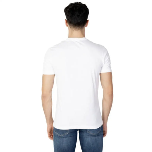 White t-shirt worn by a person, viewed from behind; Calvin Klein Jeans Men T-Shirt