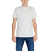 Young man wearing white t-shirt and blue jeans from Tommy Hilfiger Jeans Men T-Shirt collection