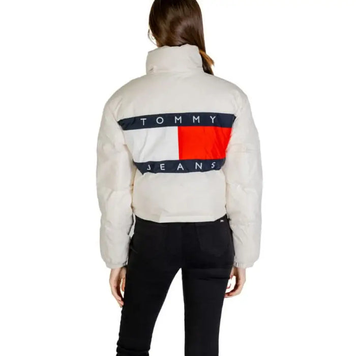 White Tommy Jeans puffer jacket featuring navy and red logo design on the back