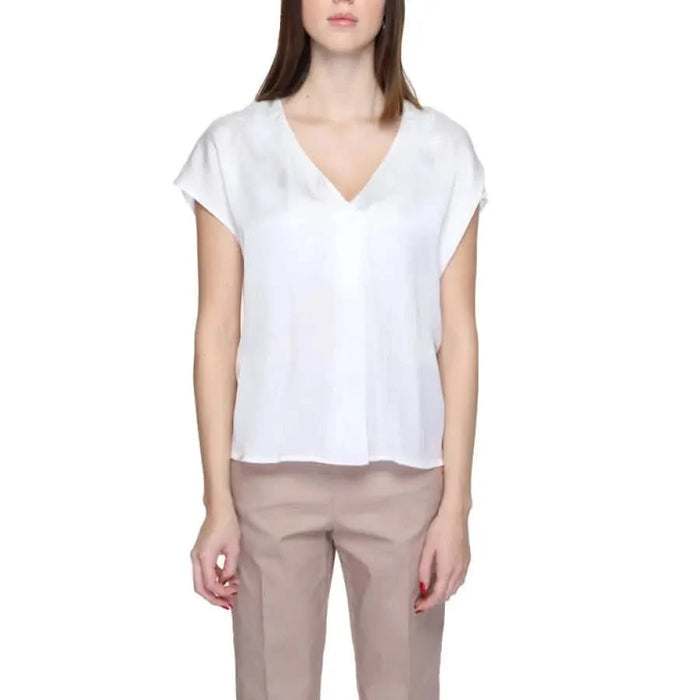 White v-neck short-sleeve blouse with loose fit from Rinascimento Women Blouse collection