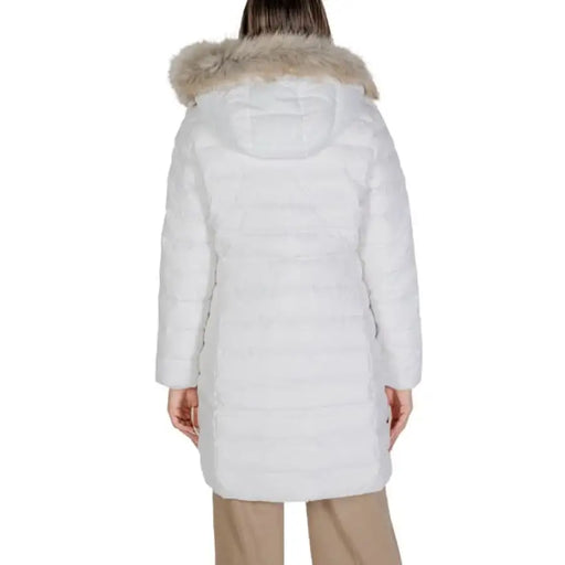 White winter puffer coat with fur-trimmed hood viewed from behind by Tommy Hilfiger Jeans