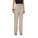 Vero Moda woman in urban style black top and beige trousers for city fashion