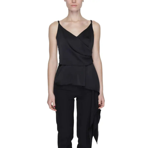 Woman in Silence brand draped back black top showcasing urban city style fashion