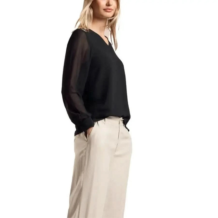 Woman in black long-sleeved top and beige pants from Street One Women Blouse