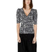 Woman in Toi Morgan black and white top with leopard print - Toi Women T-Shirt