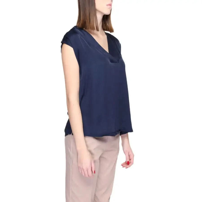 Urban Style: Woman in Blue Street One Blouse with Beige Pants - Trendy Women’s Clothing