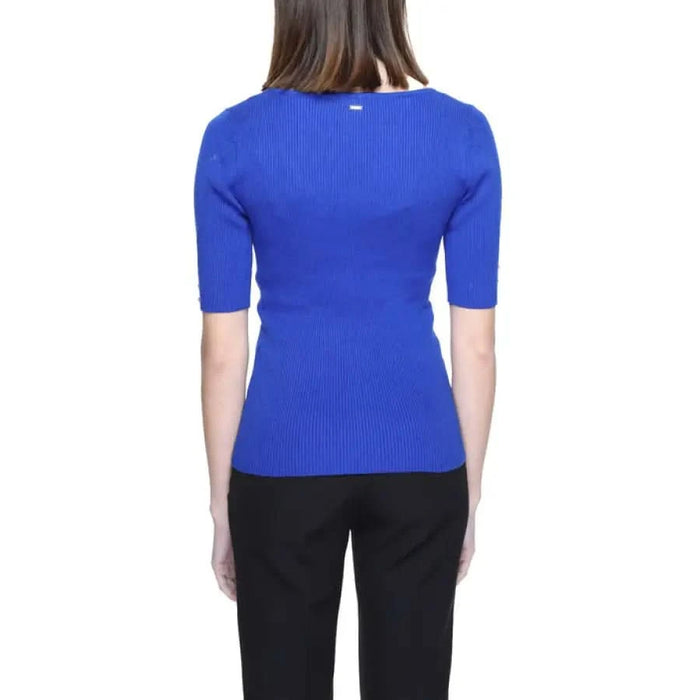 TOI Morgan De Toi women knitwear featuring woman in blue top and black pants