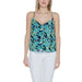 Woman in Morgan De Toi urban style floral top, blending urban city fashion