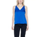 Woman in blue Vila Clothes top showcasing urban style clothing