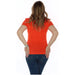 Woman in bright red Love Moschino T-Shirt and blue jeans, seen from behind