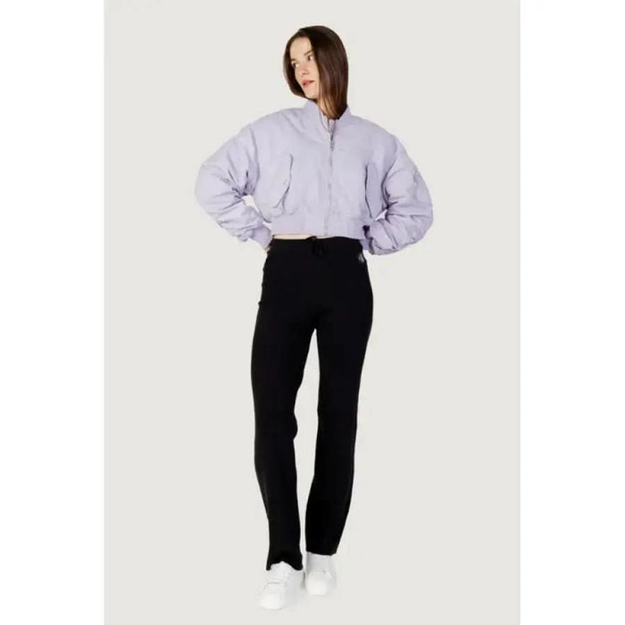 Woman in cropped lavender jacket and black pants from Calvin Klein Jeans Women Jacket