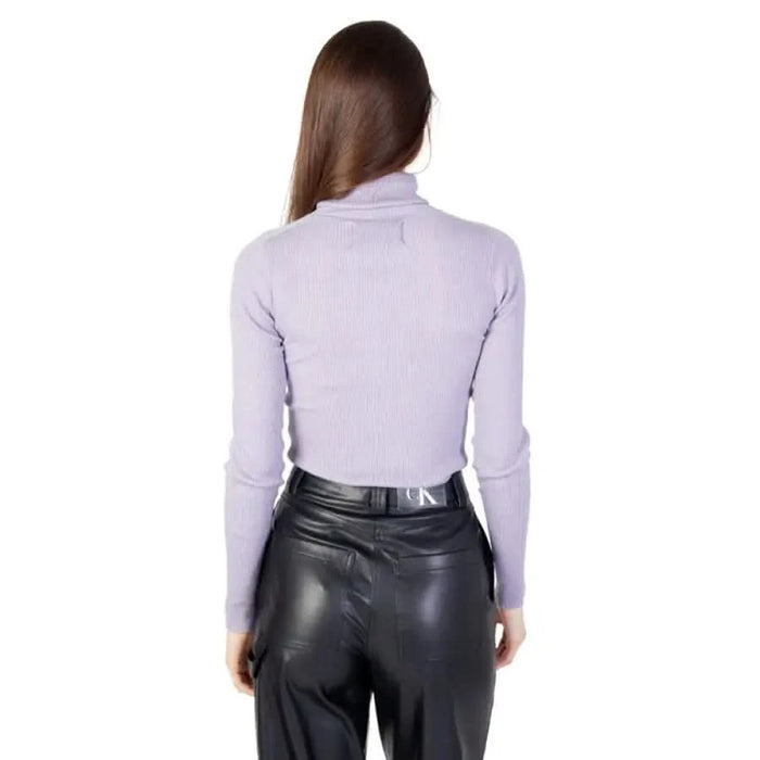 Woman in light purple turtleneck and black leather pants, Calvin Klein Jeans Knitwear