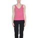 Vero Moda urban style clothing, woman in pink top and black pants, city fashion