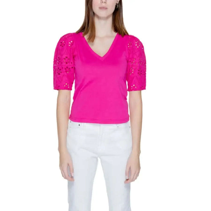 Woman in pink cut-out top, Morgan De Toi urban city style clothing