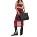 Woman in red and black dress holding Calvin Klein Women Bag