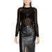 Woman in sheer black long-sleeved top and leather skirt from Vila Clothes Knitwear