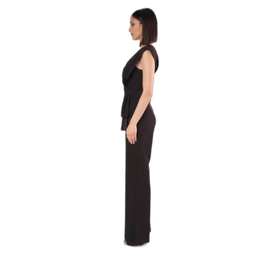 Side profile of woman wearing sleek black Silence Women Jumpsuit