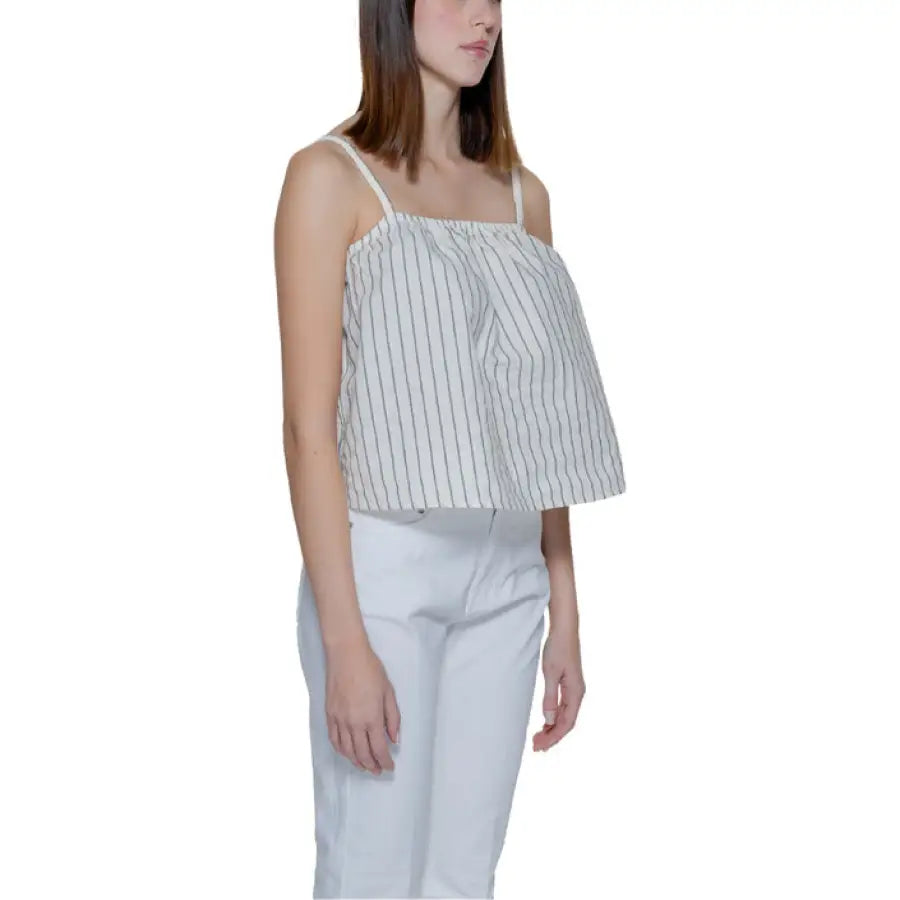 
                      
                        Vero Moda woman in urban style striped top for trendy urban city fashion
                      
                    