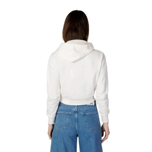 Woman wearing white cropped hoodie and blue jeans - Calvin Klein Jeans Women’s Sweatshirts