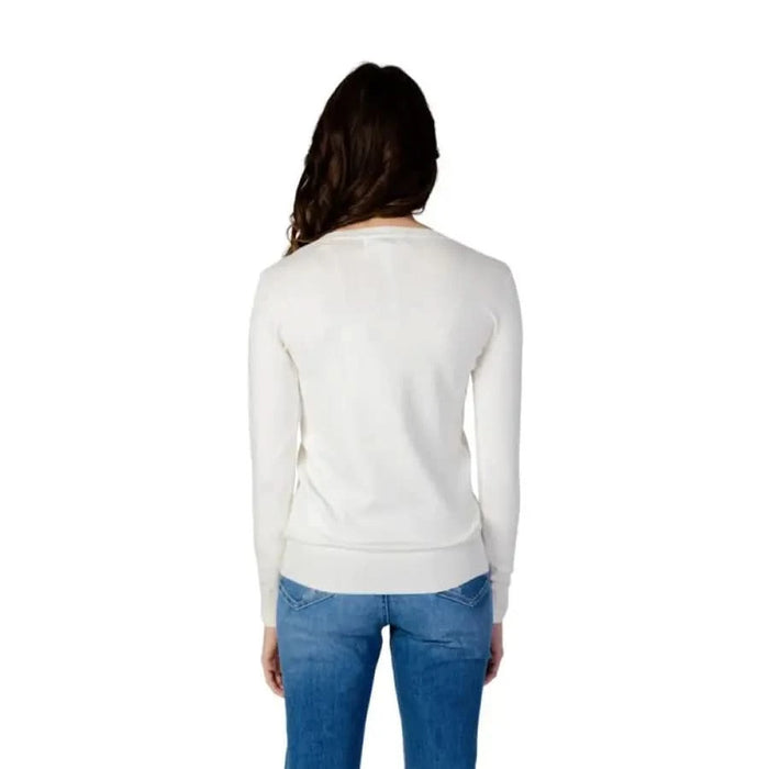 Guess women knitwear - Woman in white sweater and jeans by Guess Guess