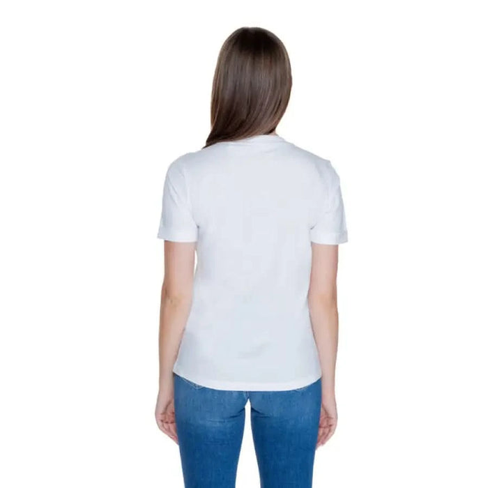 Woman in white t-shirt and blue jeans, rear view, Guess Women T-Shirt product image