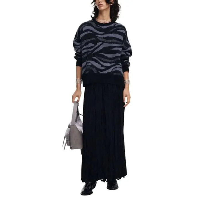 Woman in zebra-print sweater and black skirt from Desigual Women Knitwear collection