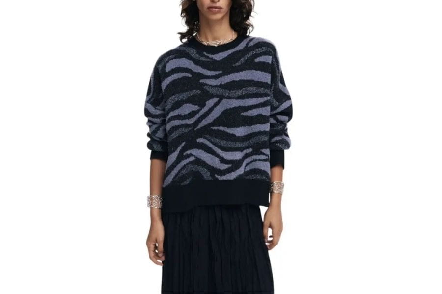 Zebra-patterned sweater featuring dark blue and gray stripes ideal for a capsule wardrobe.