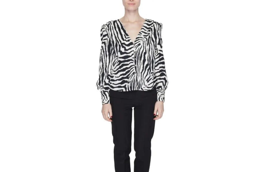 Zebra-print blouse with long sleeves and V-neckline for stylish holiday outfit.